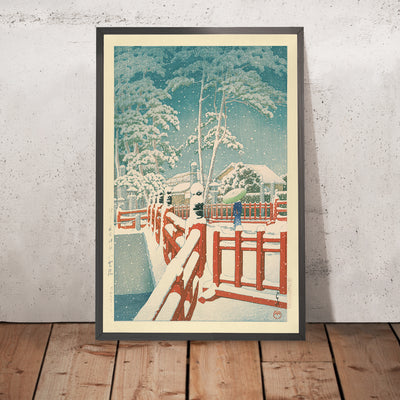 A framed image of Snow at Yakumo Bridge at the Nagata Shrine Kobe by Hasui Kawase 1935