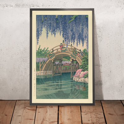 A framed image of Wisteria Bridge at Komeido by Hasui Kawase, 1935