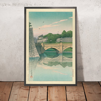 A framed image of Morning at Nijubashi Bridge by Hasui Kawase, 1935