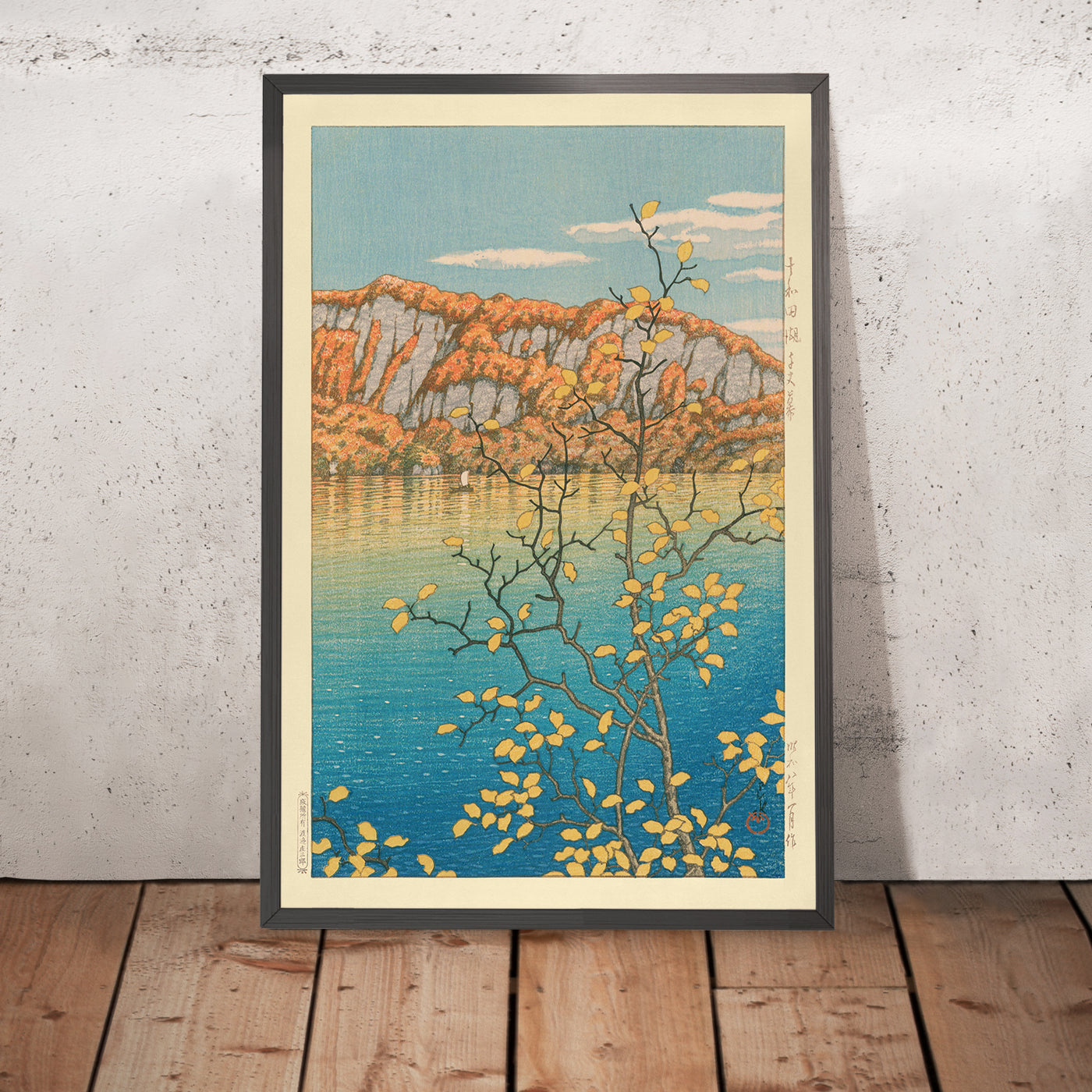 A framed image of Senjo Cliff in Towada Lake by Hasui Kawase, 1935